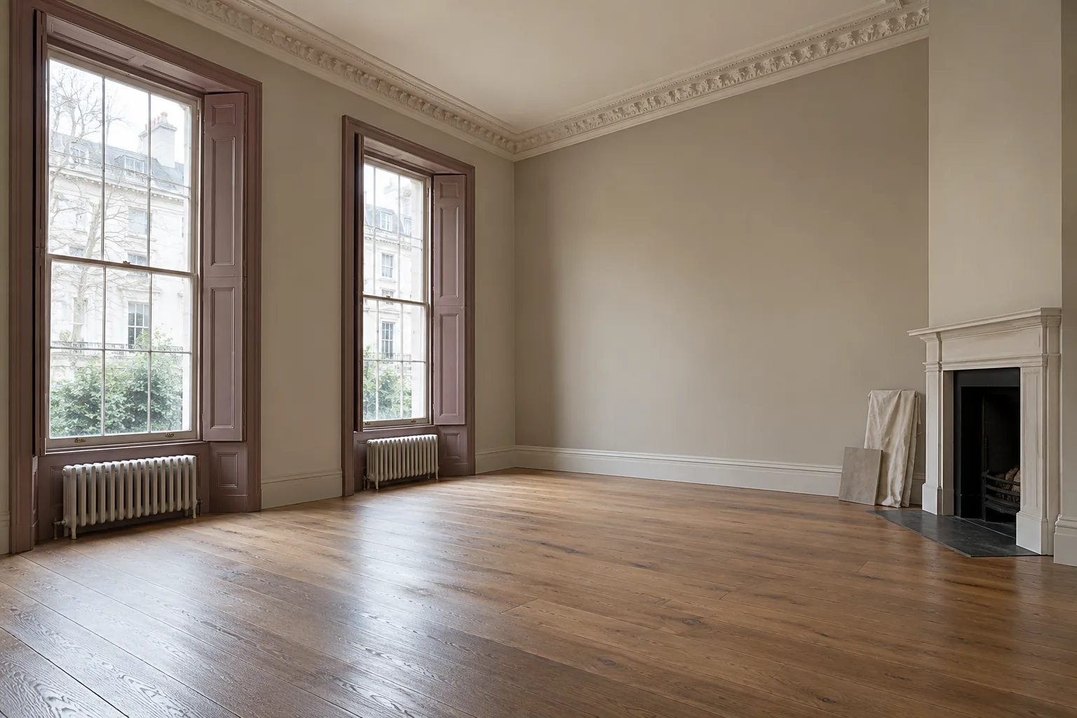High-ceilinged flat with tall sash windows and a plaster cornice